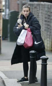 Dani Dyer in a Black Puffer Coat