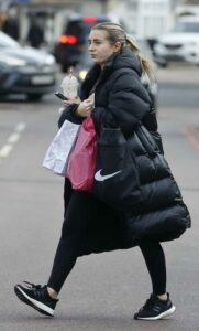 Dani Dyer in a Black Puffer Coat