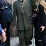 Emma Brooks in an Olive Pantsuit Arrives at the Ferrari Fashion Show During 2023 Milan Fashion Week in Milan 02/25/2023