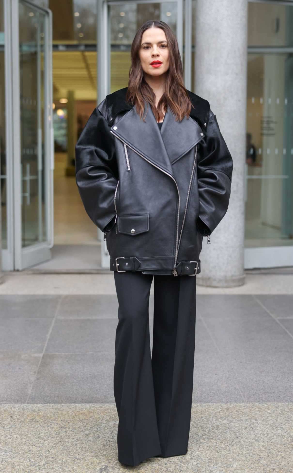 Hayley Atwell in a Black Leather Jacket Arrives at the Del Core Fashion