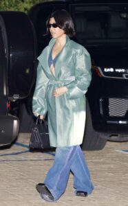 Kourtney Kardashian in an Olive Coat