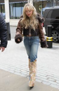 Sabrina Carpenter in a Brown Leather Jacket