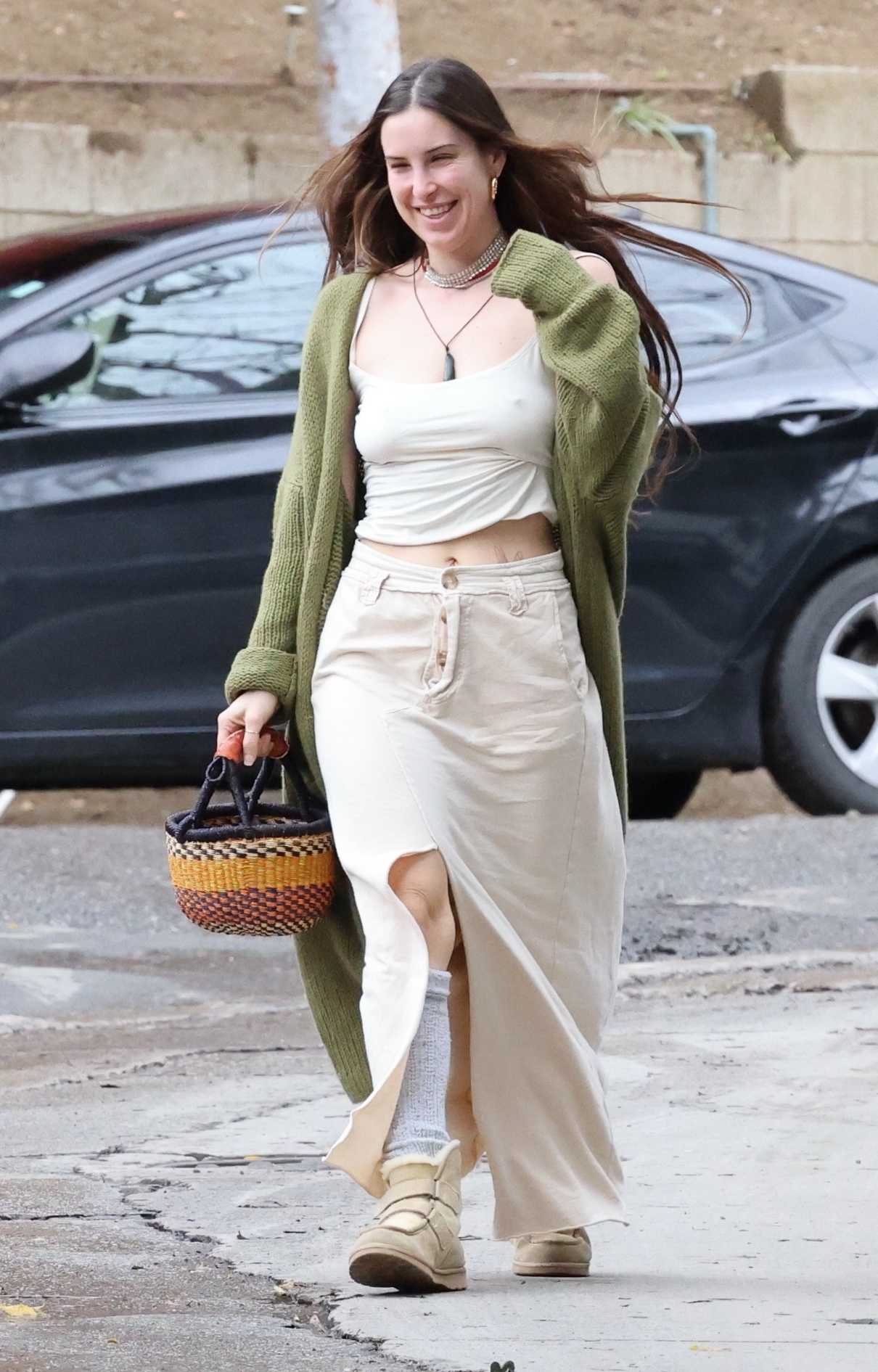 Scout Willis in an Olive Cardigan
