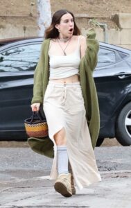 Scout Willis in an Olive Cardigan