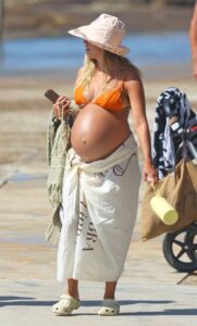 Renee Bargh in an Orange Bikini