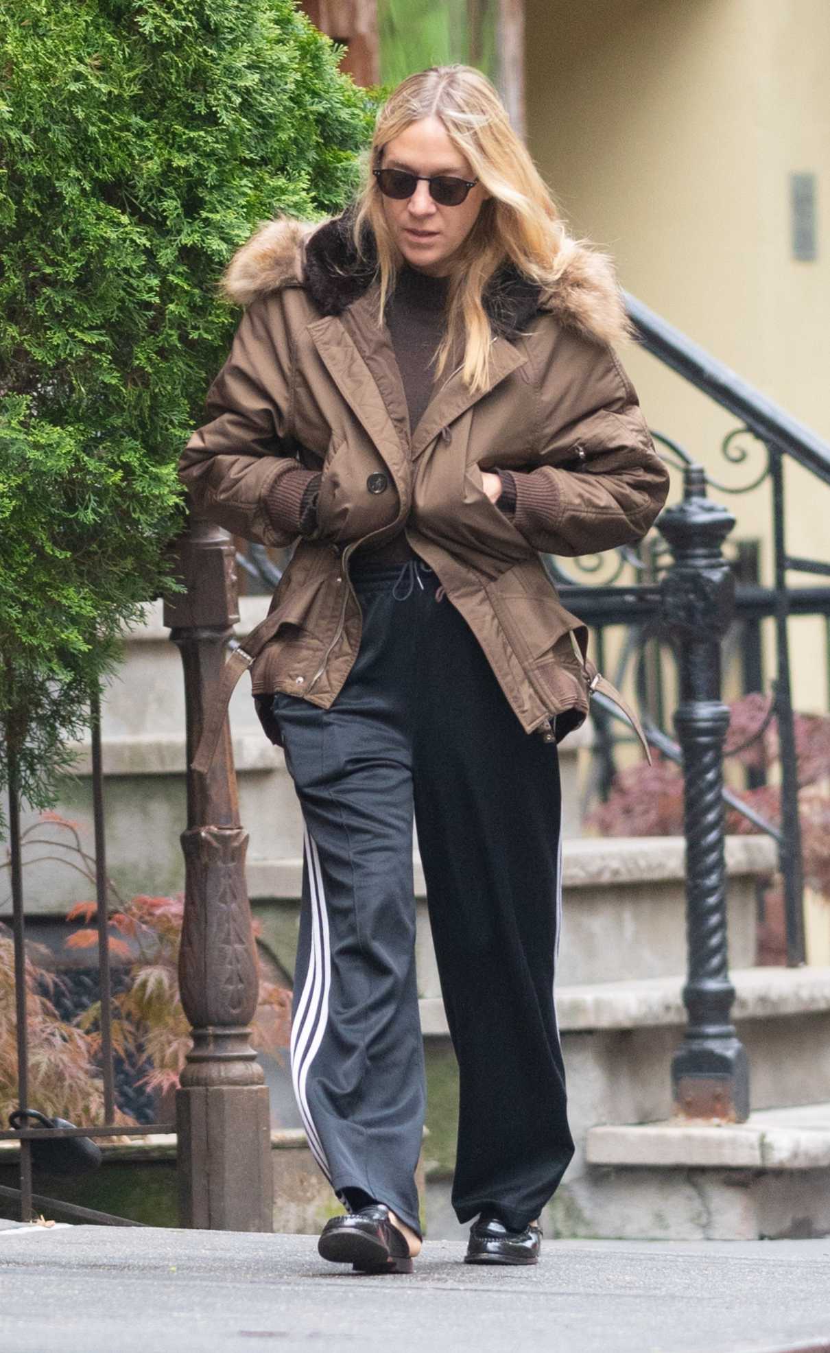 Chloe Sevigny in a Black Adidas Track Pants