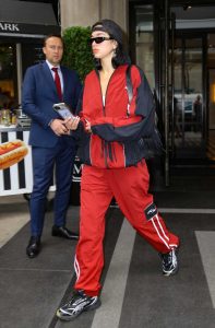 Dua Lipa in a Red and Black Tracksuit