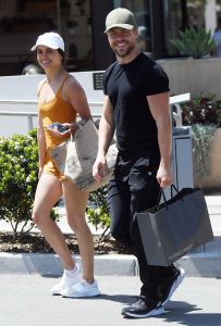 Hayley Erbert in an Orange Workout Ensemble