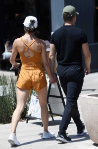 Hayley Erbert in an Orange Workout Ensemble