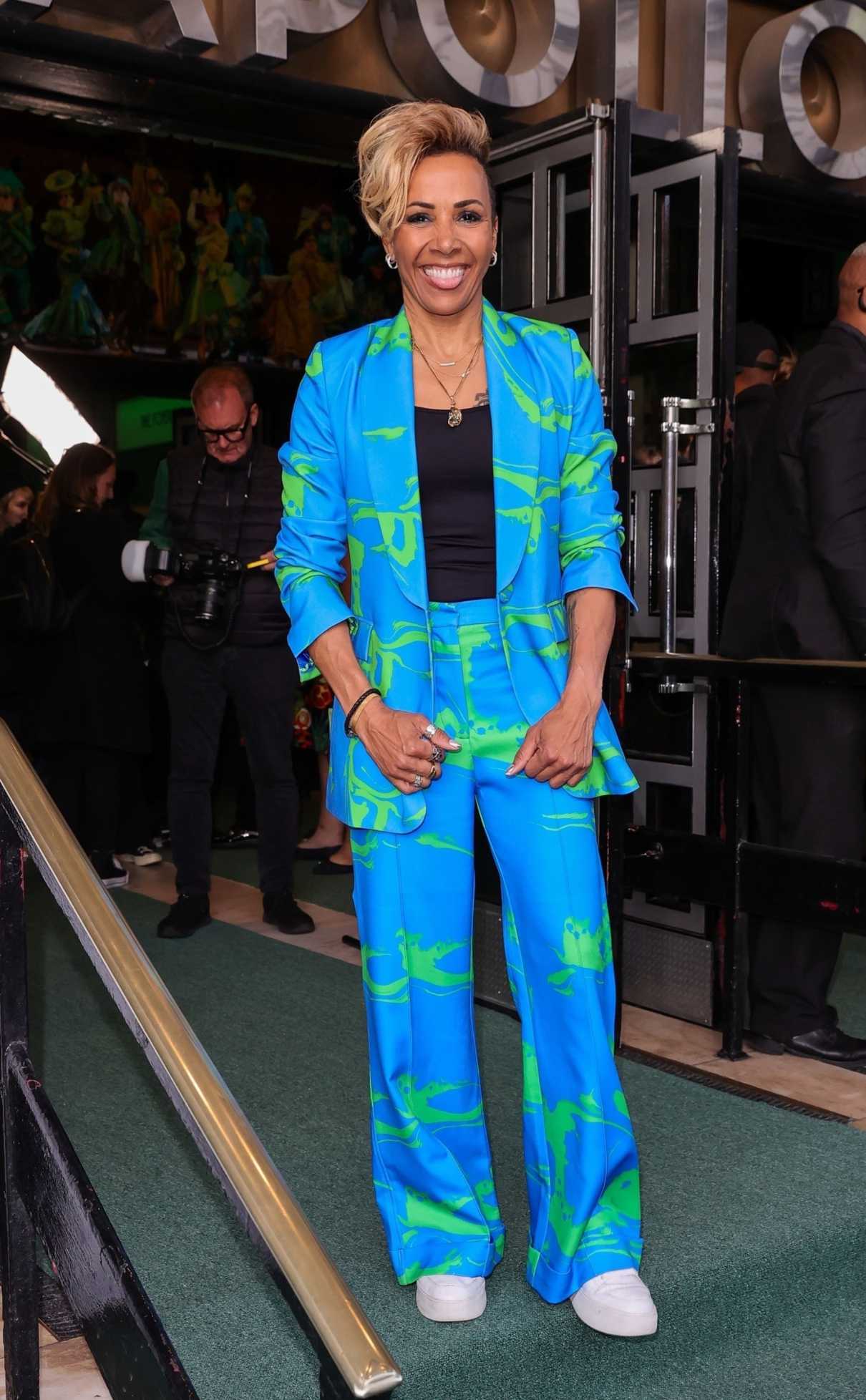 Kelly Holmes in a Bright Blue Printed Trouser Suit