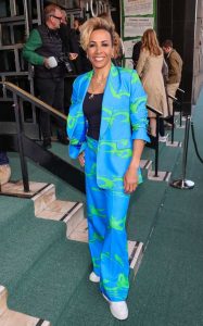 Kelly Holmes in a Bright Blue Printed Trouser Suit