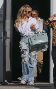 Khloe Kardashian in a Blue Ripped Jeans