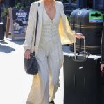 Laura Whitmore in a White Striped Trouser Suit Arrives at the Heart Breakfast Show in London 04/20/2023