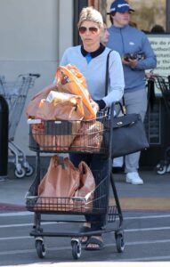 Lori Loughlin in a Black Flip-Flops