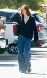 Riley Keough in a Navy Blue Cardigan