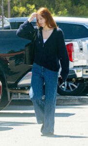 Riley Keough in a Navy Blue Cardigan