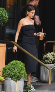 Hailey Bieber in a Black Strapless Dress