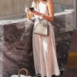 Ines De Ramon in a White Polka Dot Dress Carrying a Large Black Gucci Bag while Out Shopping in Beverly Hills 04/29/2023