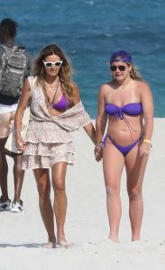 Kelly Bensimon in a Purple Bikini