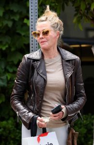 Melanie Griffith in a Brown Leather Jacket
