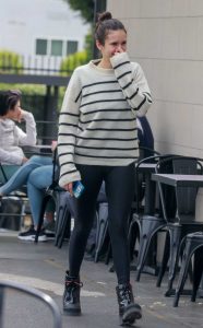 Nina Dobrev in a White Striped Sweater