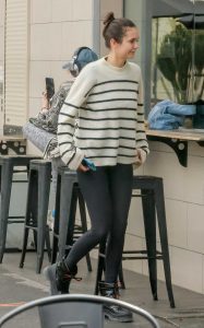 Nina Dobrev in a White Striped Sweater