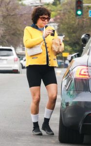 Alia Shawkat in a Yellow Cardigan