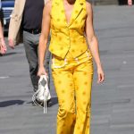 Ashley Roberts in a Bright Yellow Pantsuit Leaves the Heart Breakfast Show in London 06/21/2023
