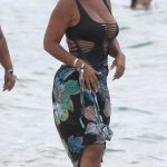 Evelyn Lozada in a Black Cutout Swimsuit Hits the Beach in Miami 06/19/2023