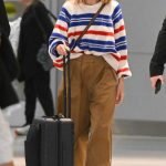 Margot Robbie in a White Cap Arrives at JFK Airport in New York City 05/31/2023