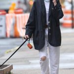 Naomi Watts in a White Ripped Jeans Walks Her Dog in New York 06/14/2023