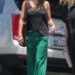 Olivia Wilde in a Green Track Pants Arrives at Roil Salon in Beverly Hills 06/29/2023