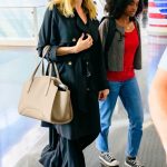 Angelina Jolie in a Black Trench Coat Arrives at JFK Airport in New York 07/18/2023