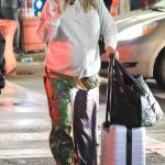 Claire Holt in a White Sweatshirt Arrives at LAX Airport in Los Angeles 08/22/2023