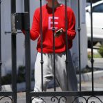 Elle Fanning in a Red Sweatshirt Picks Up a Food Delivery in Los Angeles 08/21/2023