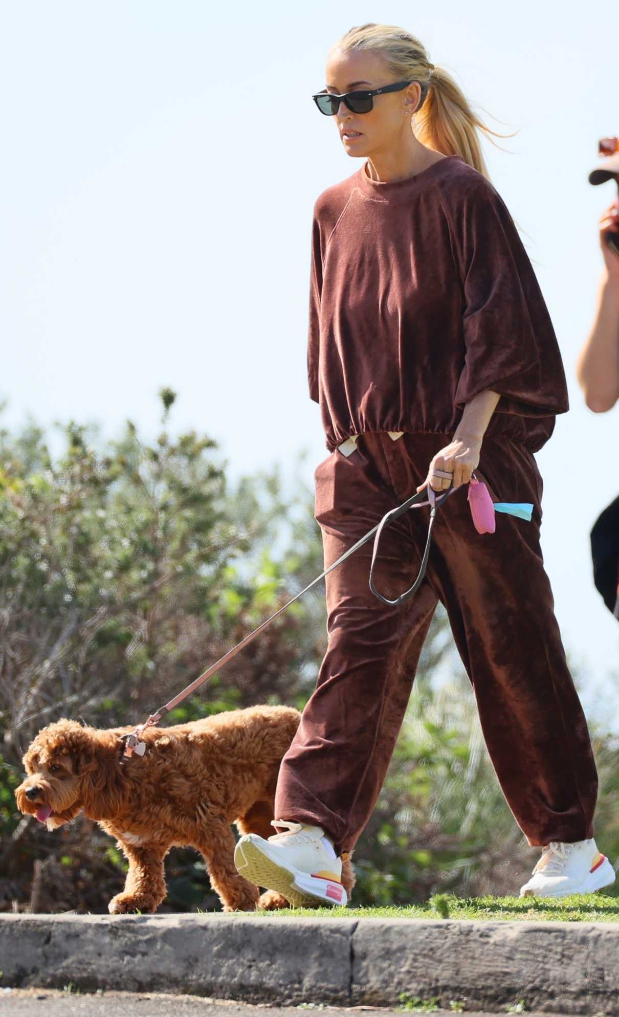 Jacqueline Ellen Last in a Brown Sweatsuit