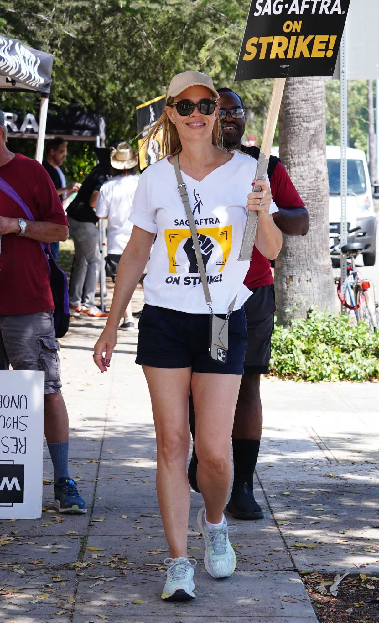 Jeri Ryan in a White Tee Attends the SAG-AFTRA and WGA Strike at Warner