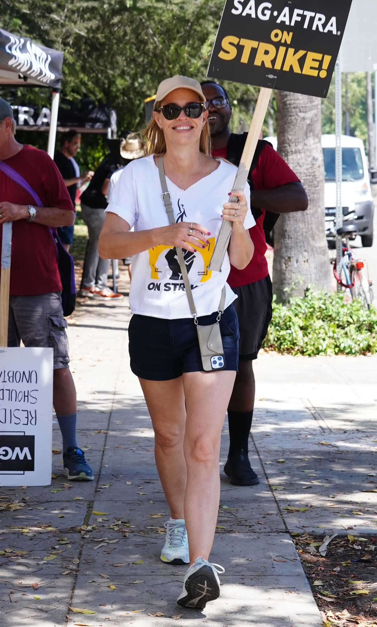 Jeri Ryan in a White Tee Attends the SAG-AFTRA and WGA Strike at Warner