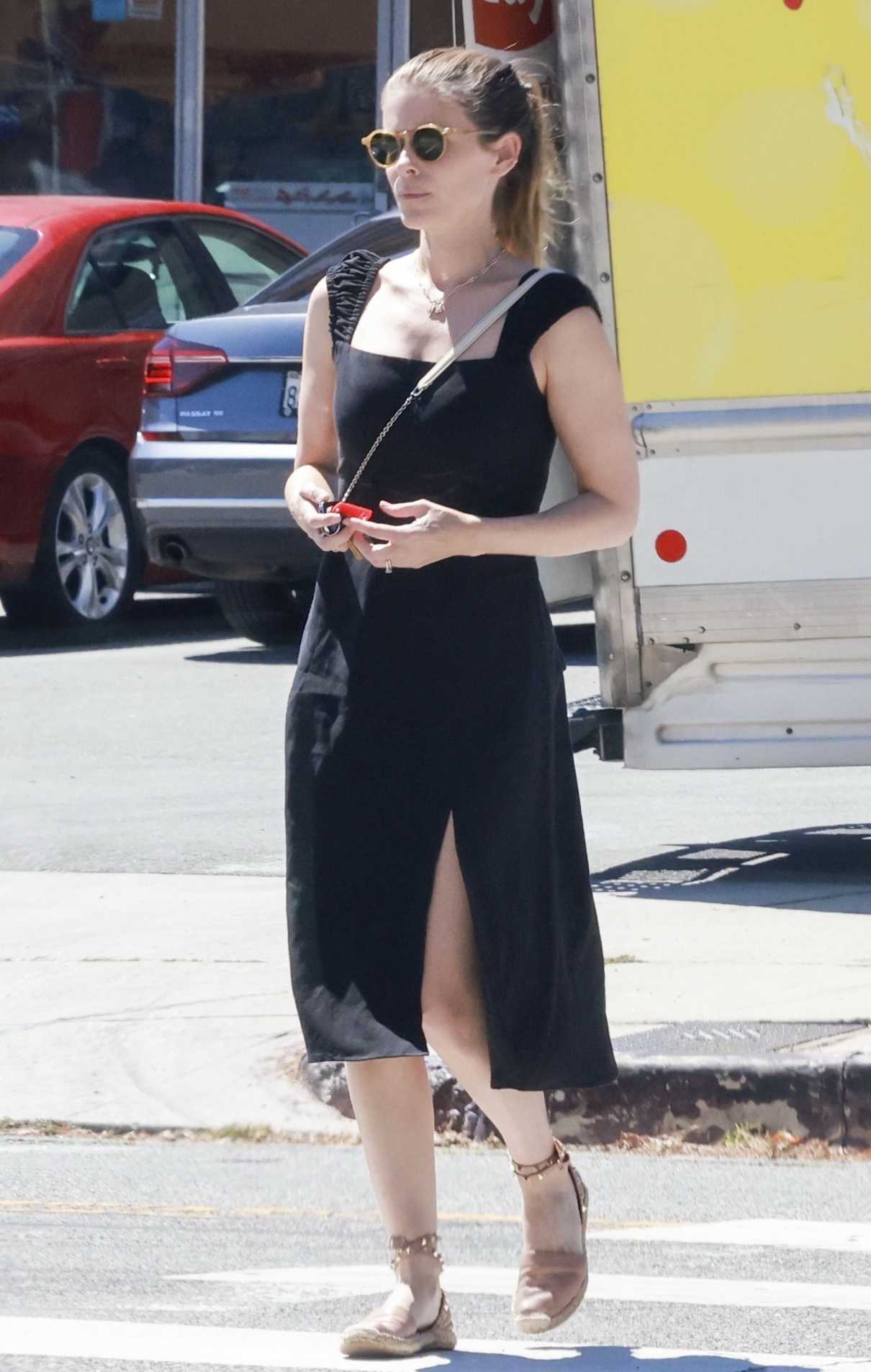 Kate Mara in a Black Dress