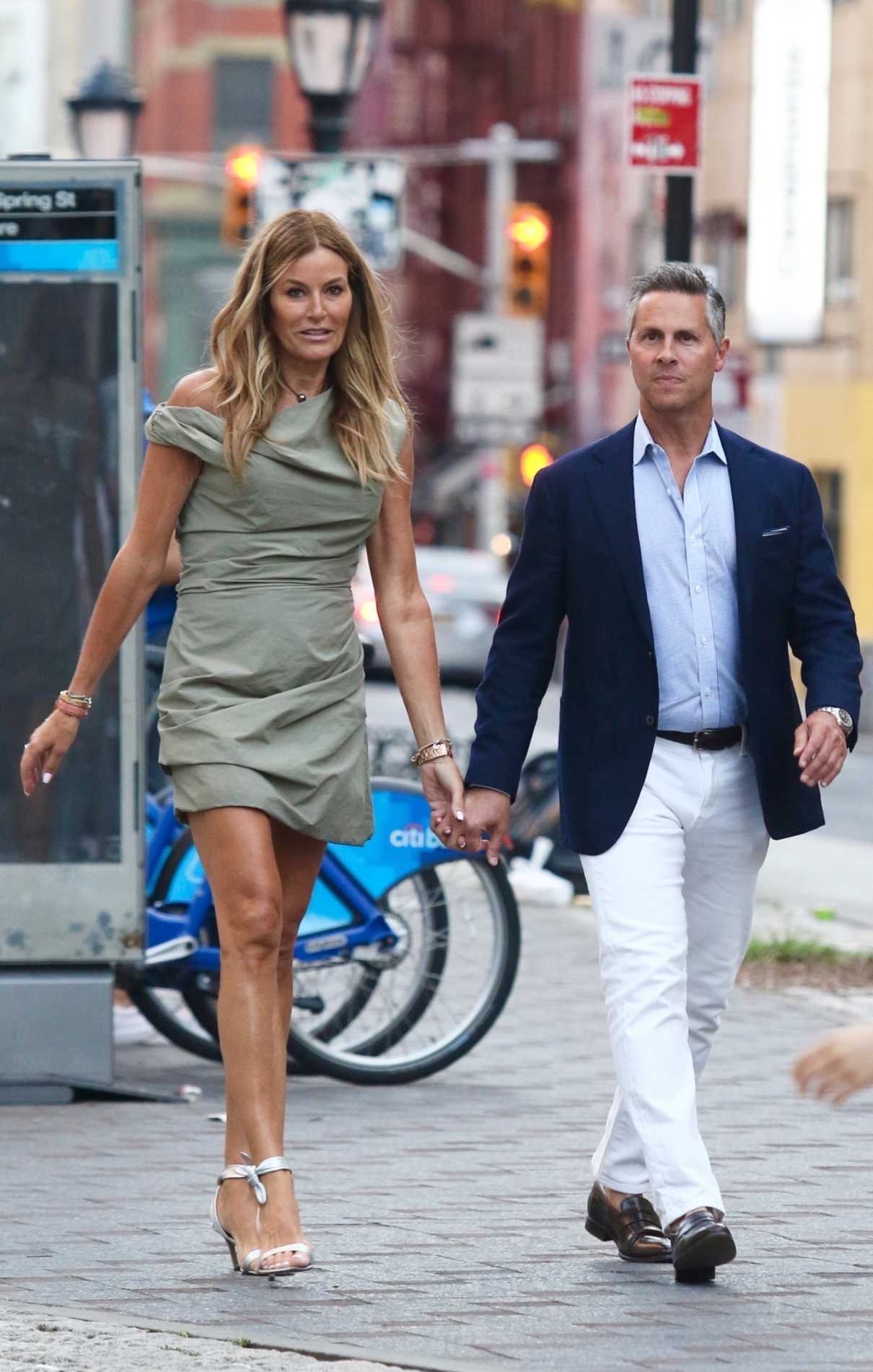 Kelly Bensimon in an Olive Dress
