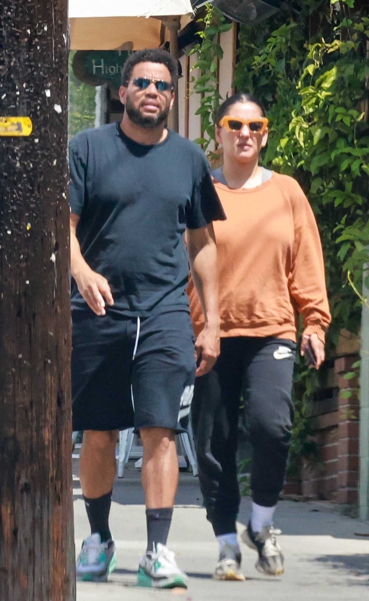 Khatira Rafiqzada in an Orange Sweatshirt