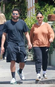 Khatira Rafiqzada in an Orange Sweatshirt