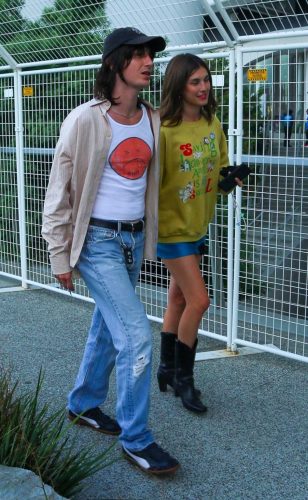 Rainey Qualley in a Blue Mini Skirt Arrives with a Friend for Taylor