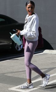 Charity Lawson in a Purple Leggings