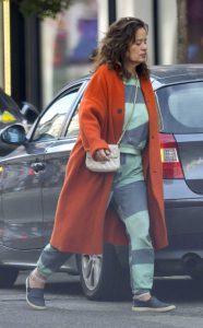 Jade Jagger in an Orange Coat