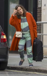 Jade Jagger in an Orange Coat