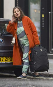 Jade Jagger in an Orange Coat