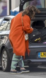 Jade Jagger in an Orange Coat