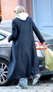 Sophie Turner in a Black Coat