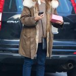 Debra Messing in a Black Sneakers Hailing a Cab in New York 12/26/2023